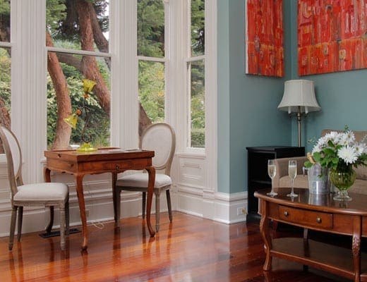 The Old Rectory sitting area table and two chairs with window view
